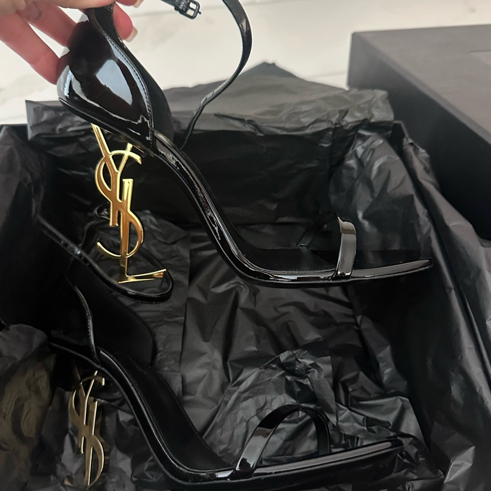 Yves Saint Laurent Opyum Patent Black Heels with Gold Logo.
